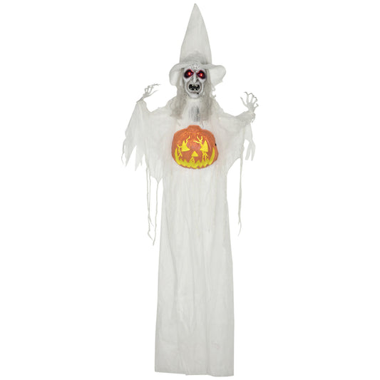 A life-size hanging witch decoration with a glowing pumpkin, positioned in a covered doorway for Halloween.